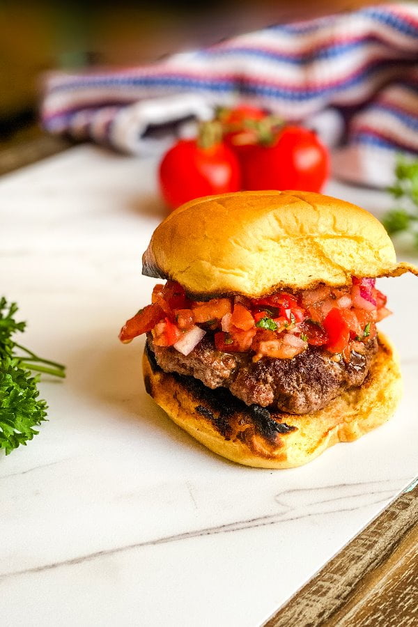 burgers on a bun with tomato relish