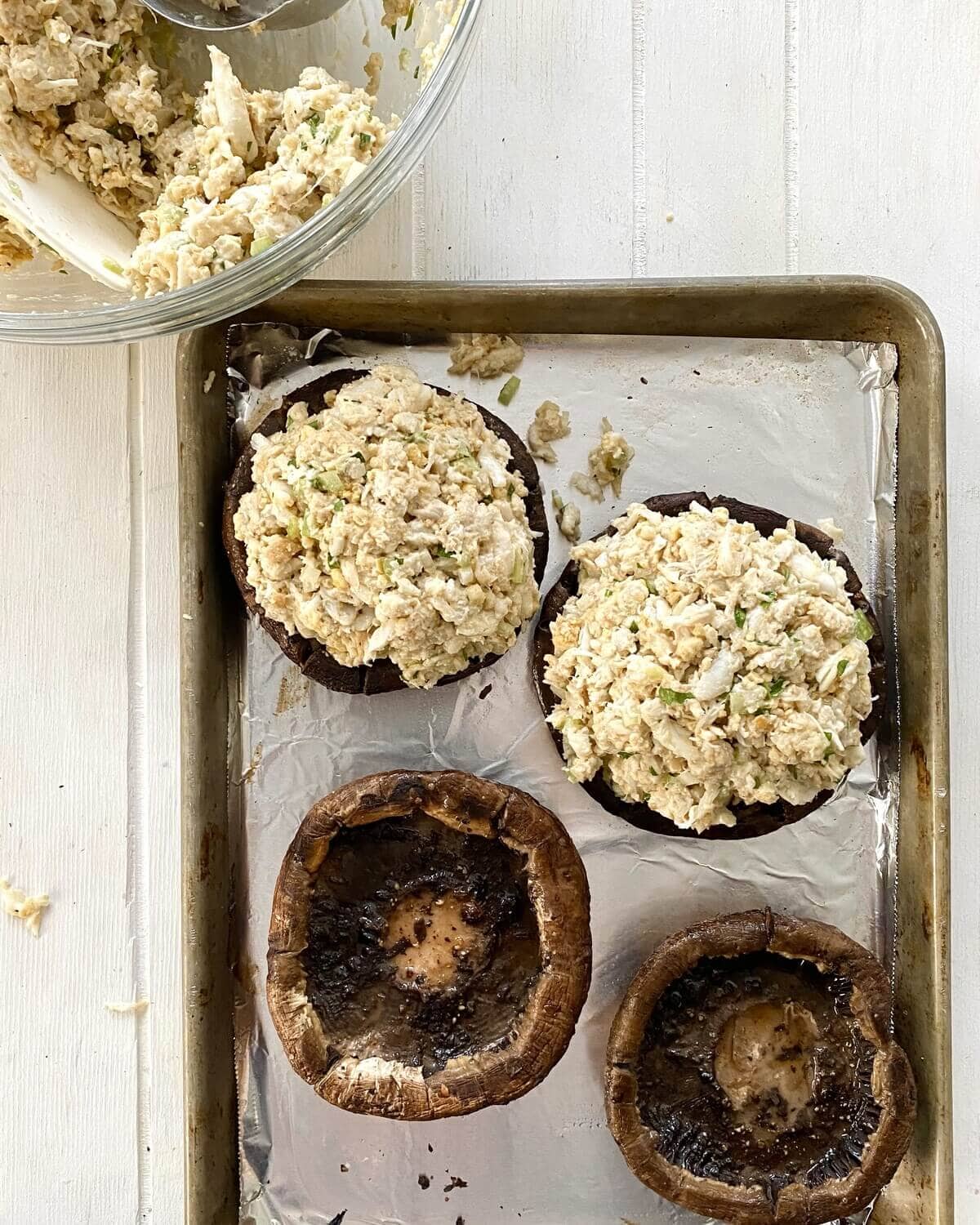 2 crab stuffed portobello mushrooms. and 2 empty mushrooms.
