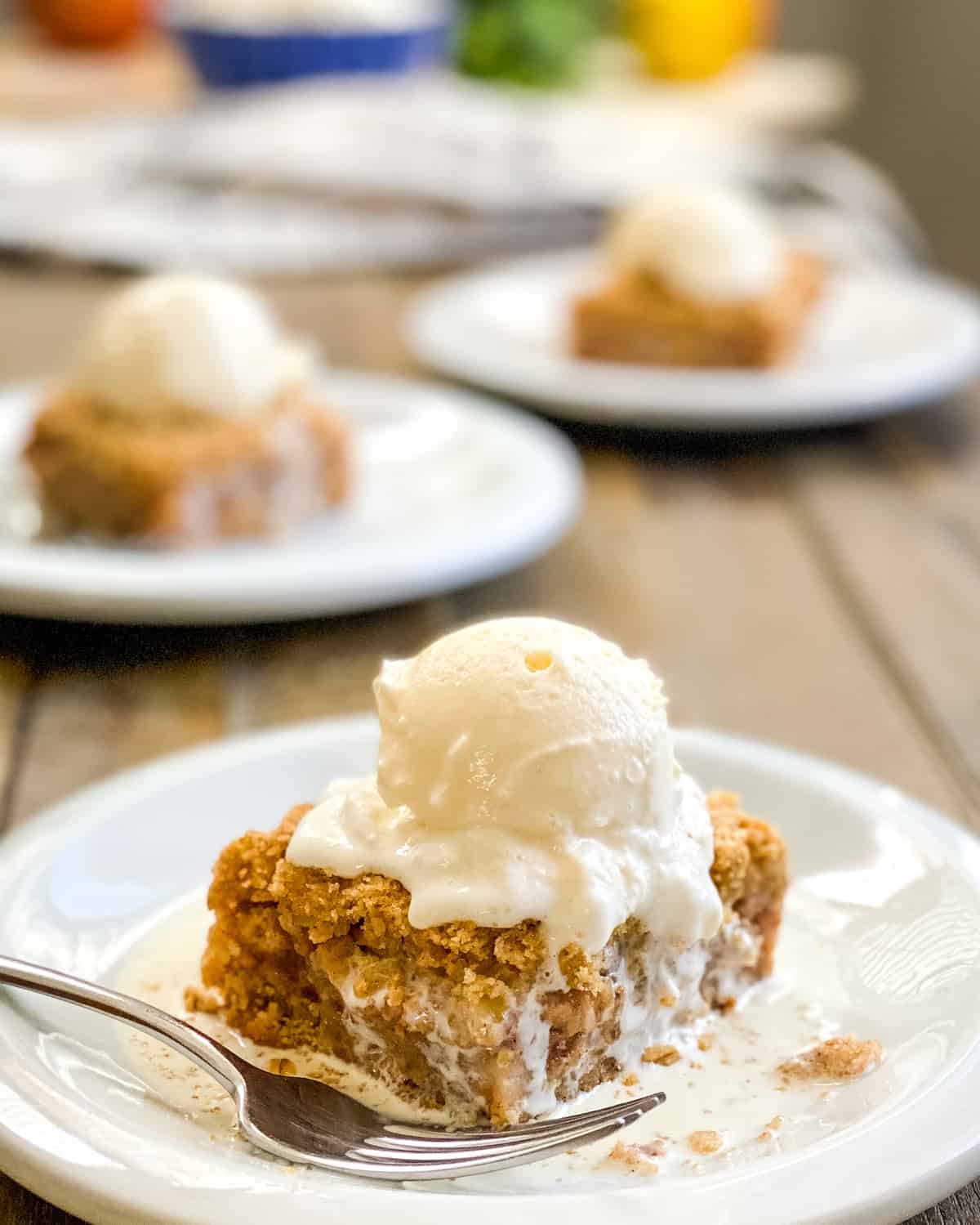 apple crumb bar topped with ice cream