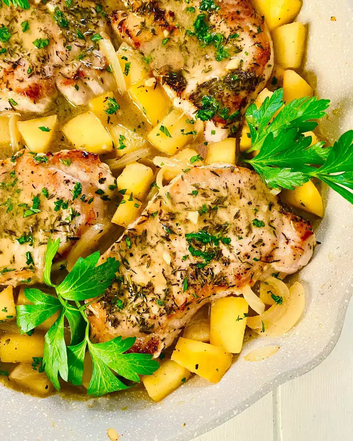 sauté pan with pork chops.