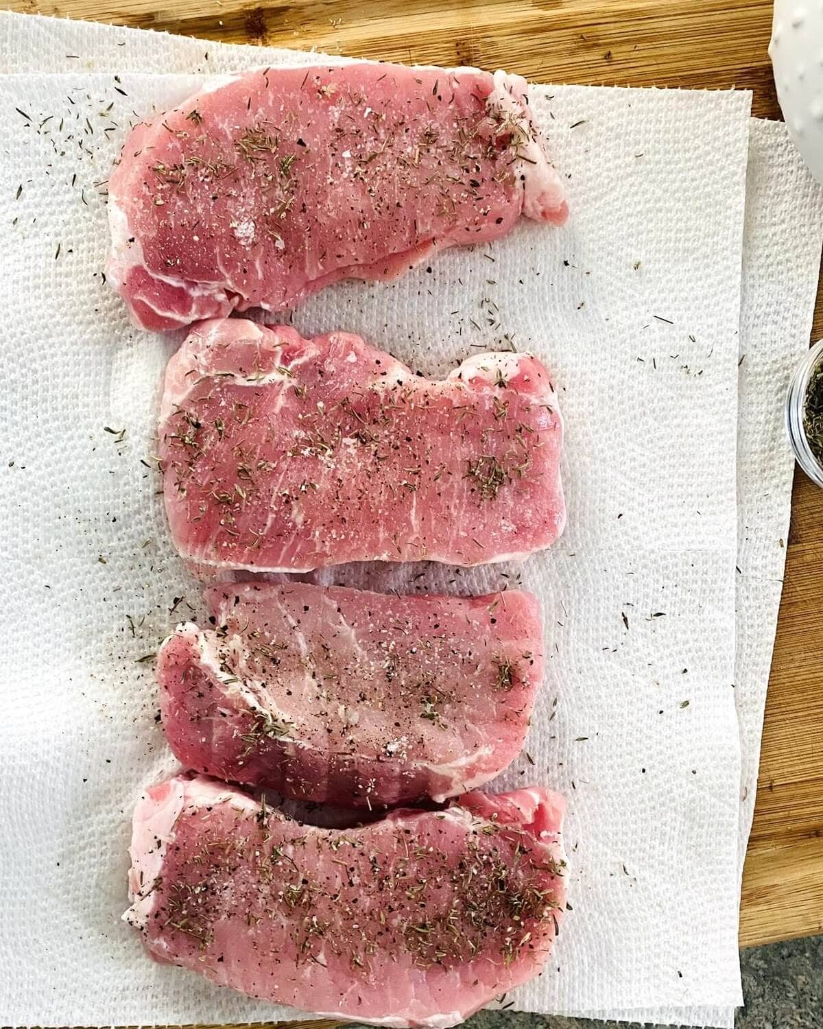 seasoning pork chops.