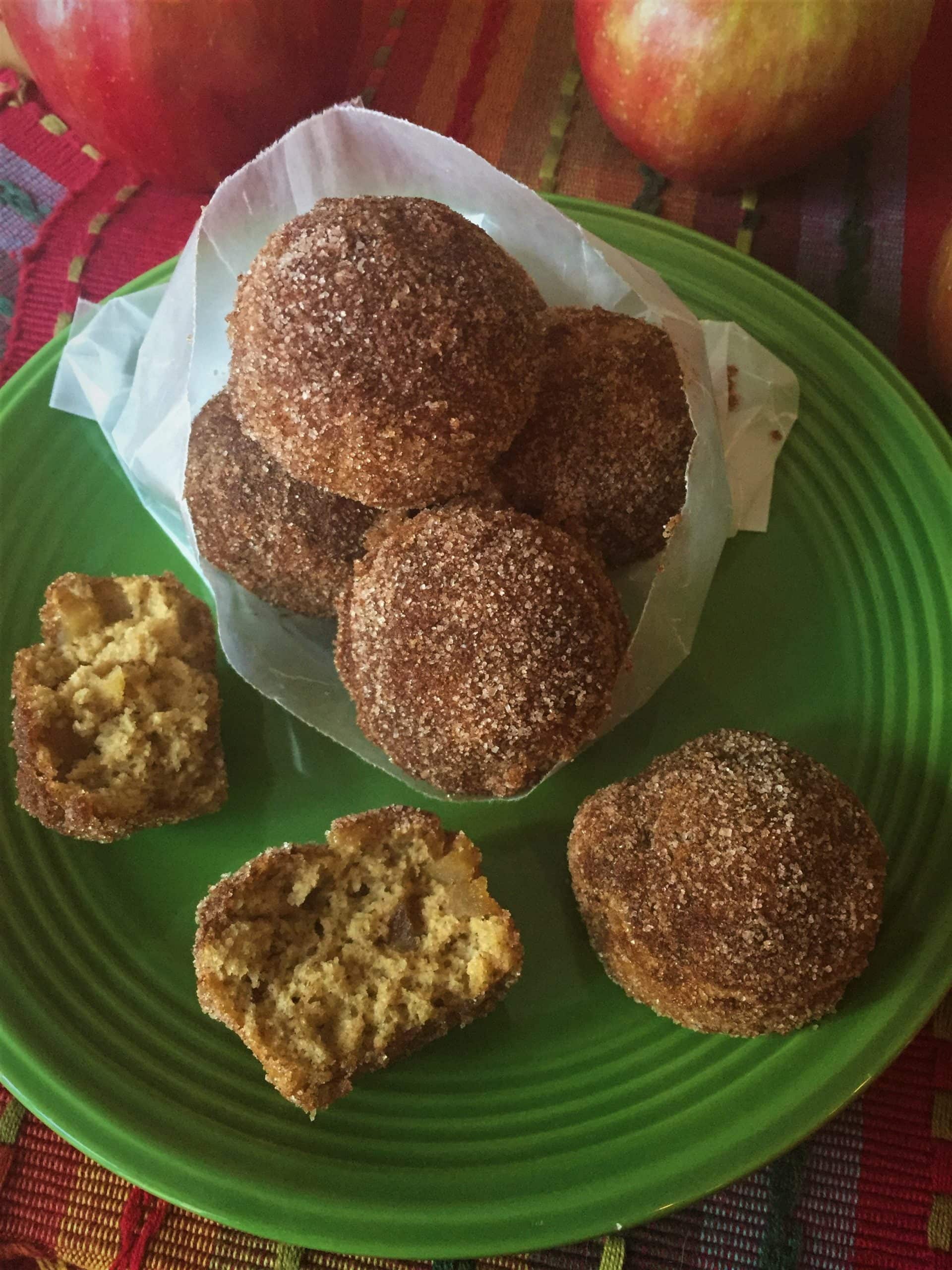 A green plate with cinnamon donut holes.