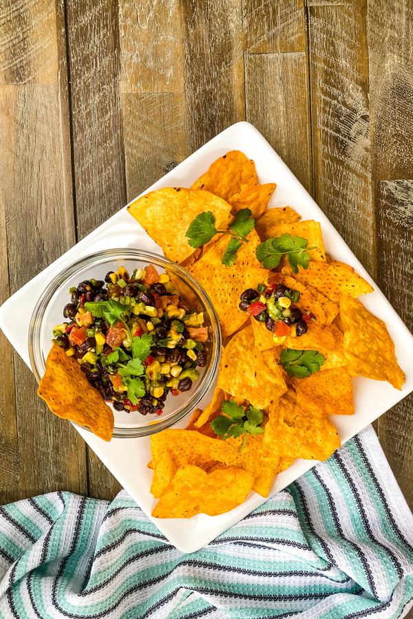 large plate of tortilla chips with Texas Caviar