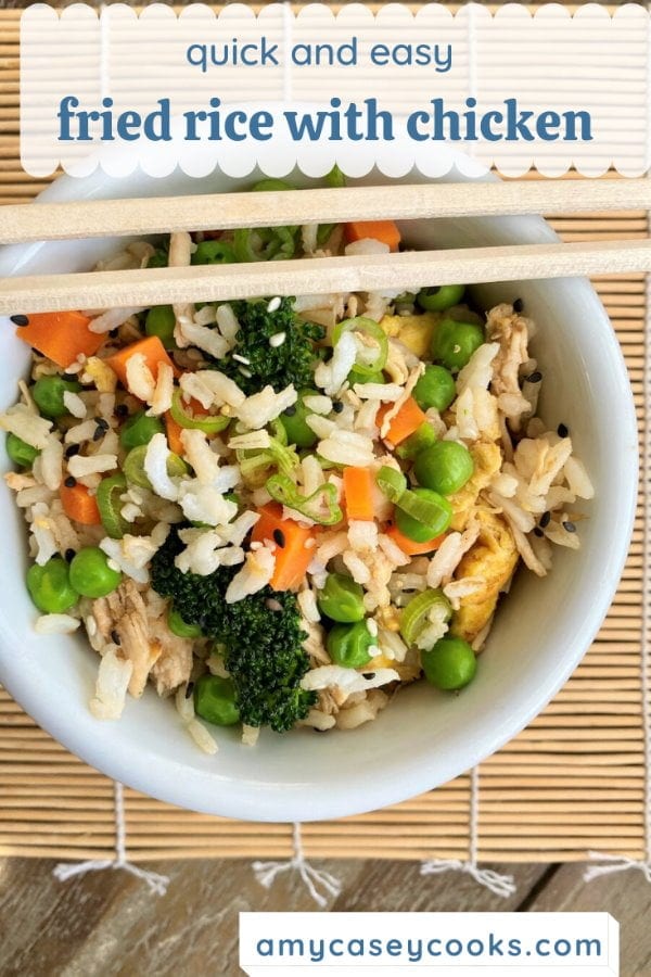 bowl of chicken fried rice with chopsticks