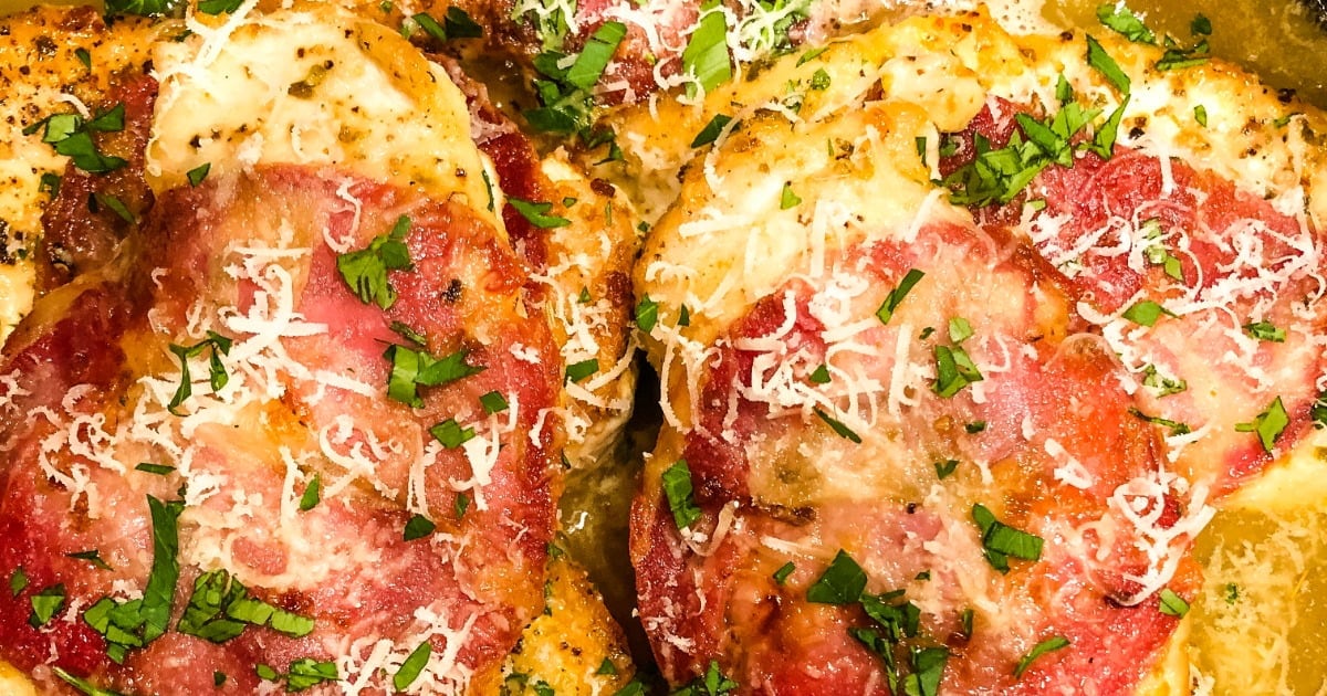 chicken topped with capicola in a white wine sauce.