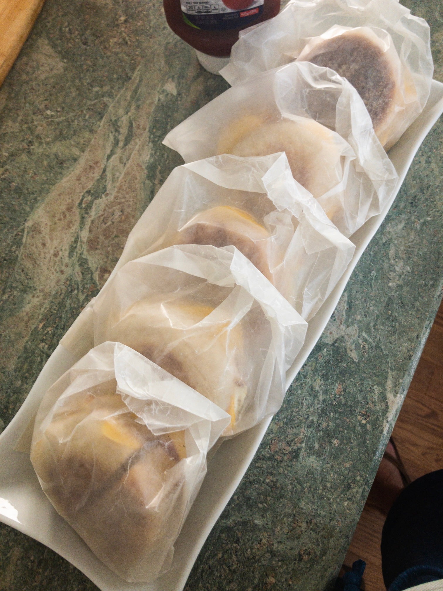 breakfast sandwiches made in advance and packaged in waxed paper bags