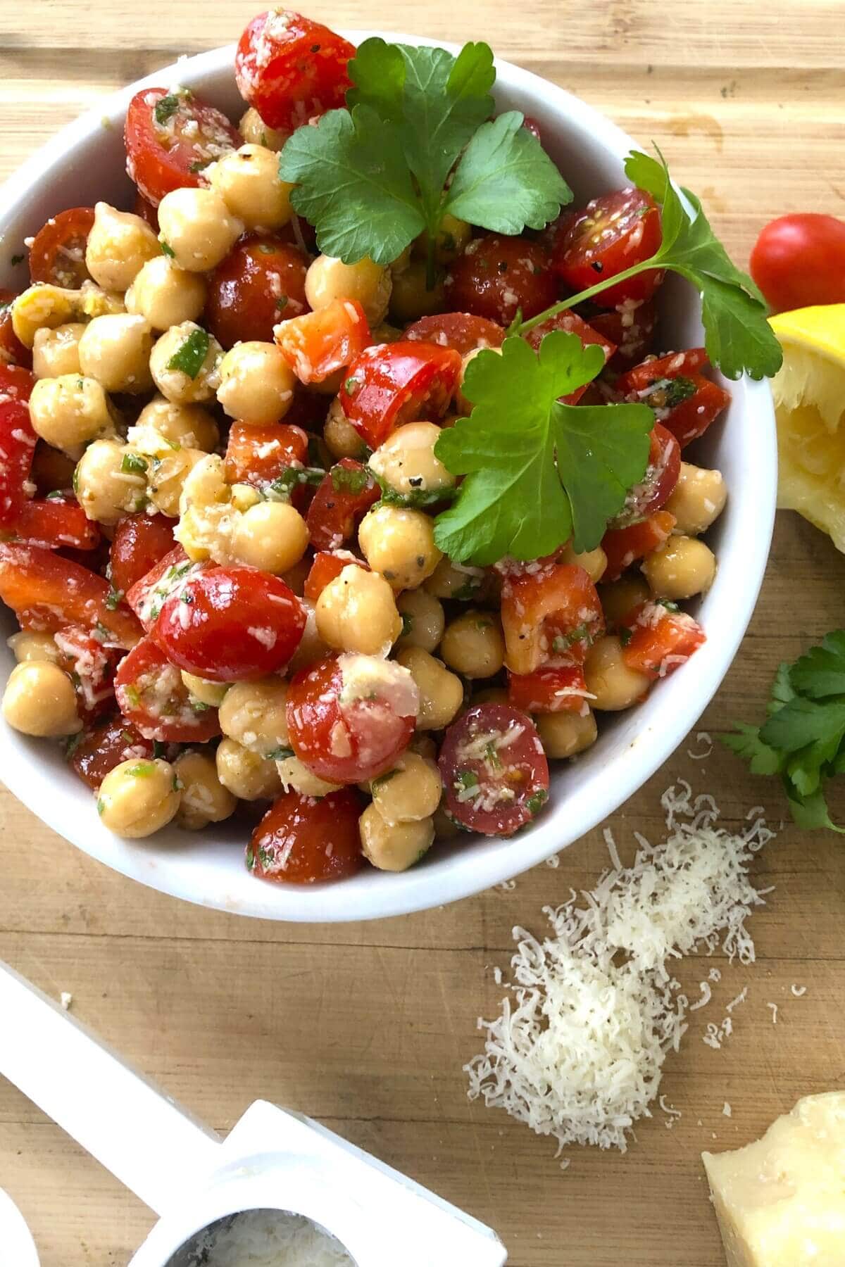 chickpeas salad in a white bowl.
