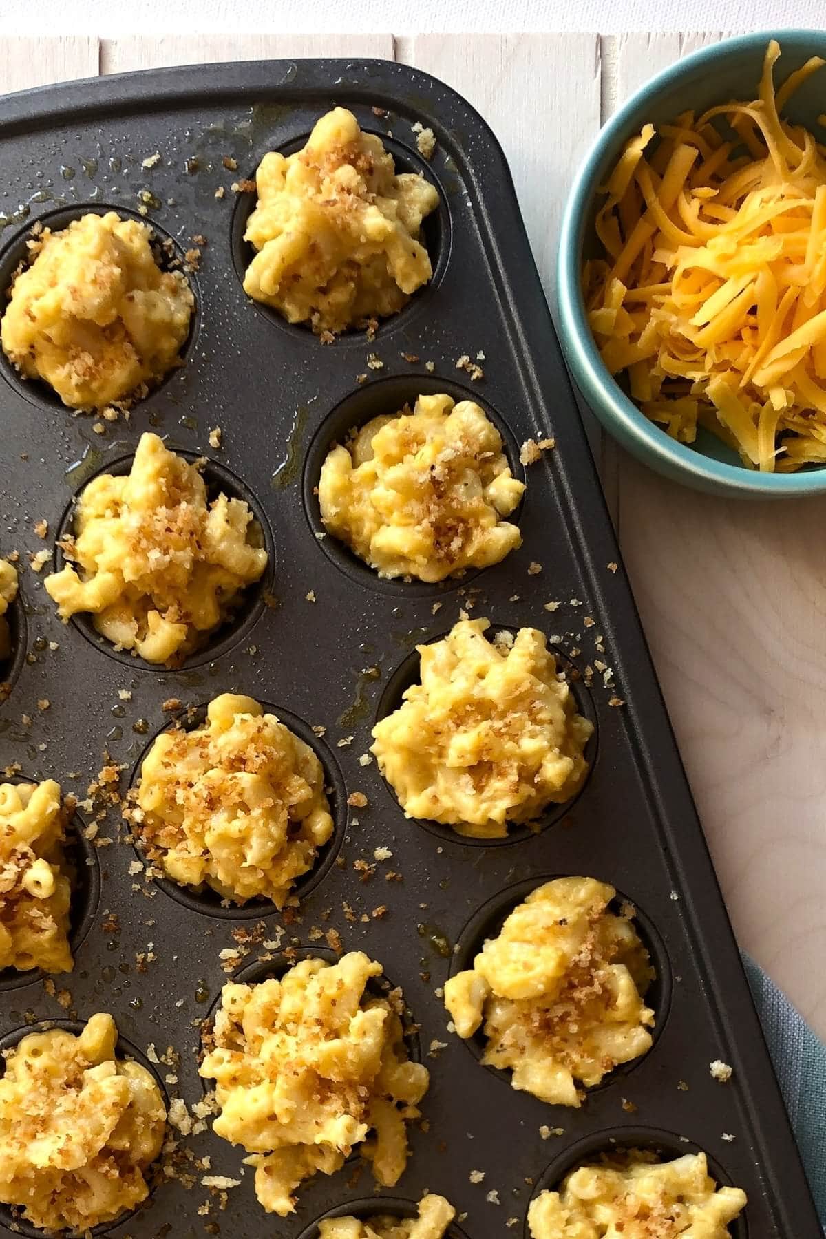 unbaked mac and cheese bites and shredded cheese.