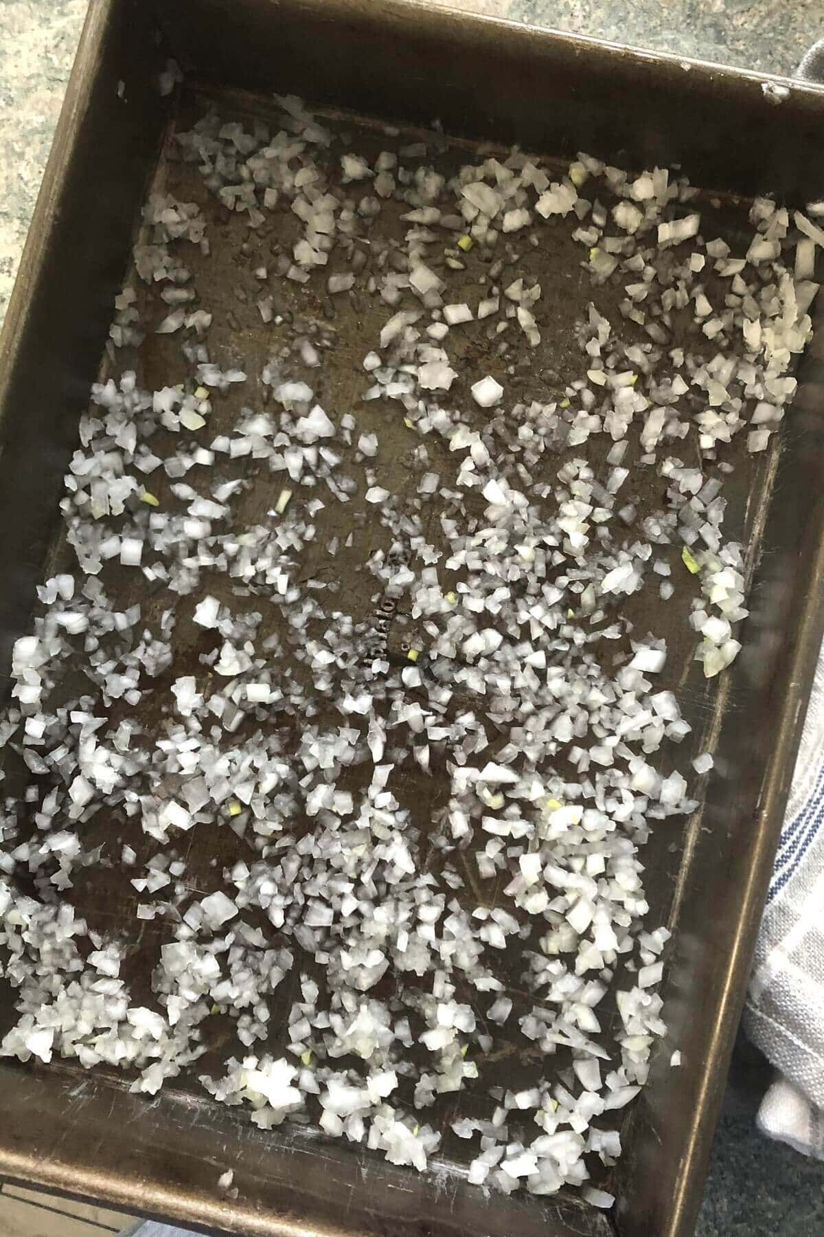 chopped onions in a baking pan.