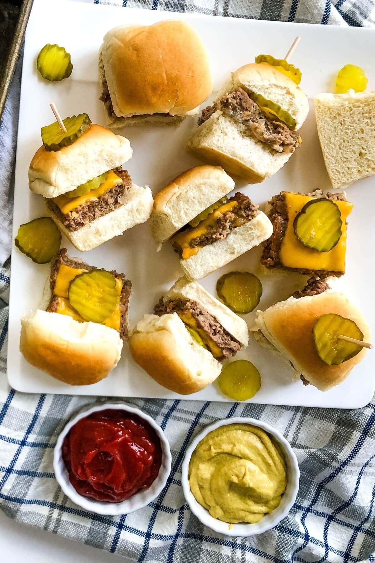Cheeseburger sliders on a platter.