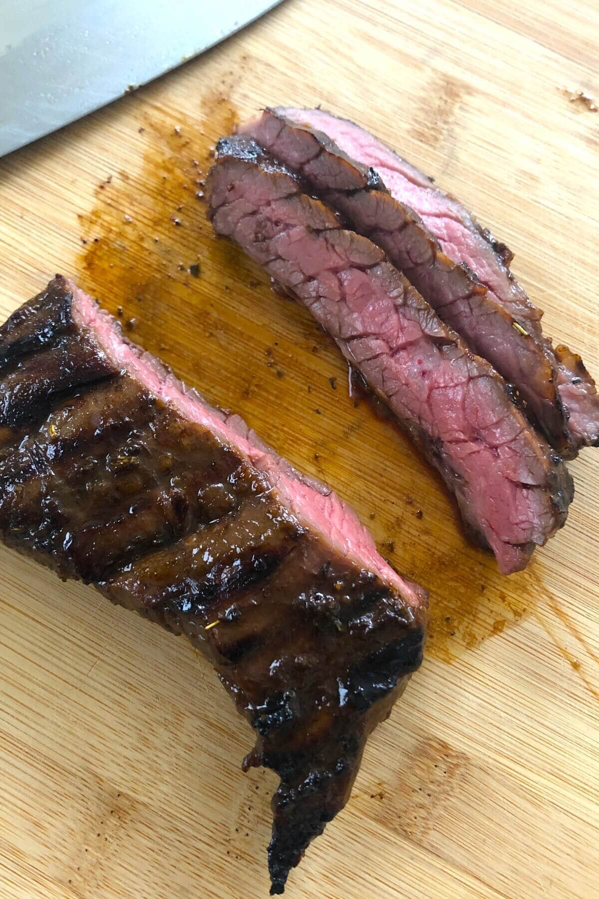 Sliced skirt steak on a cutting board.