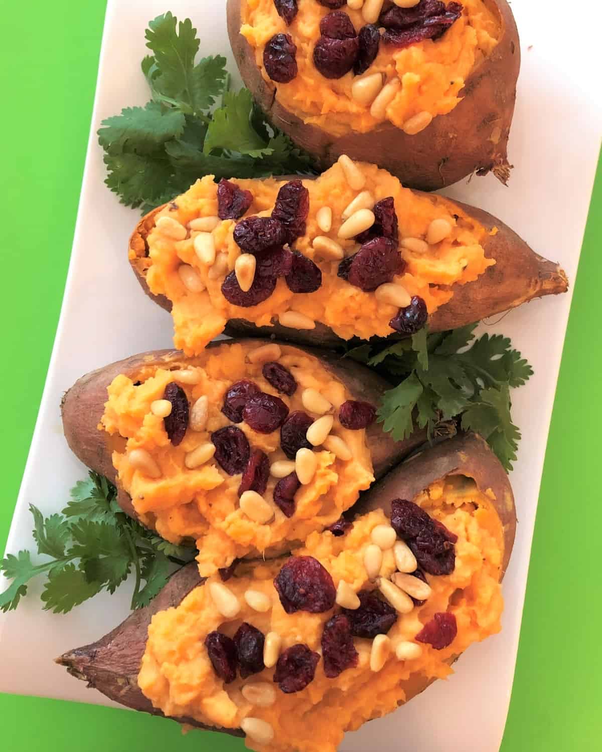 baked and stuffed sweet potatoes with raisins and pine nuts