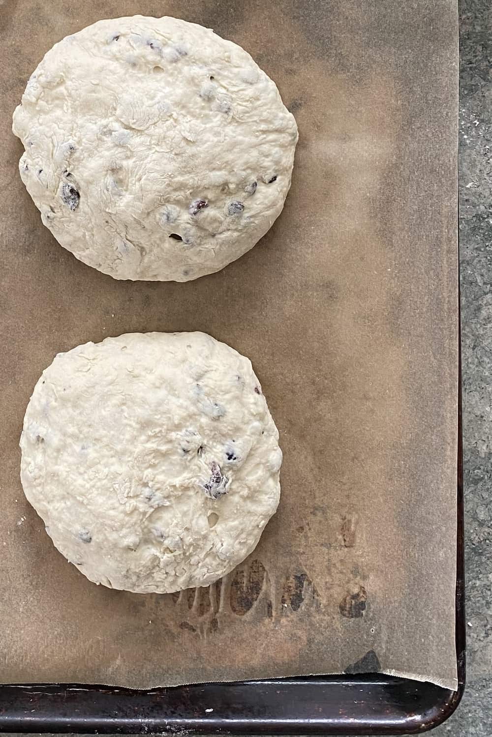 2 unbaked loaves of Irish soda bread.