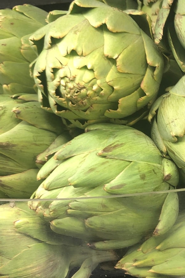 close up of 2 artichokes