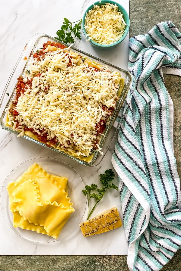 an assembled and unbaked layered Italian pasta dish