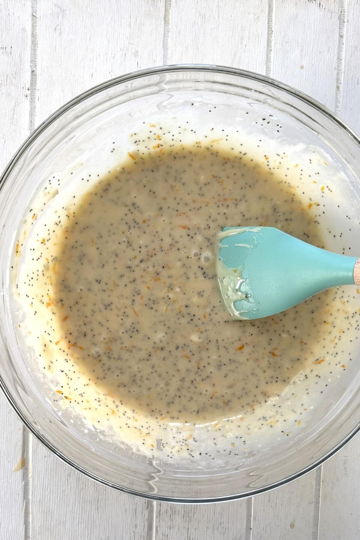 Muffin batter and a spatula in a bowl.