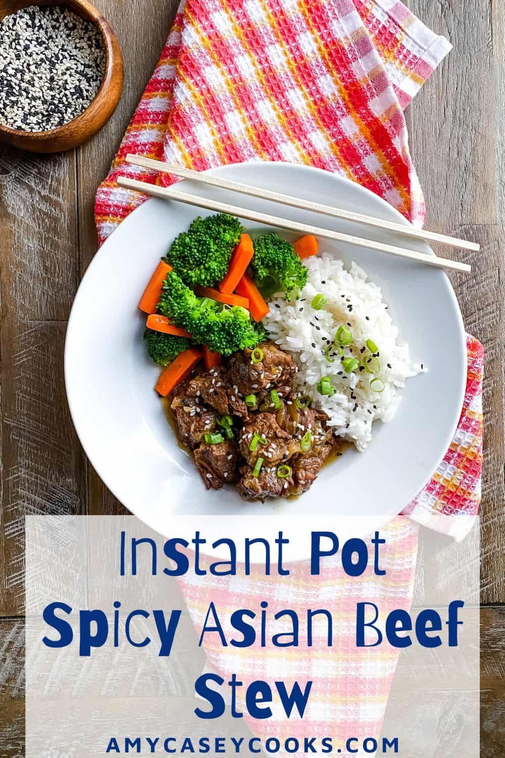 beef stew with Asian spices with rice, broccoli, carrots and chopsticks