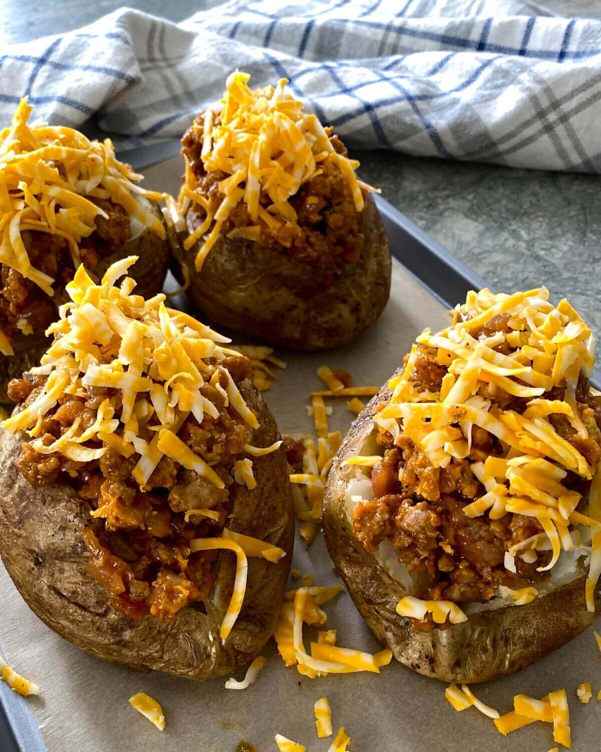 sloppy joe potatoes with shredded cheese.