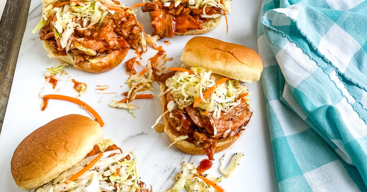 Barbecue pork sliders with tangy cole slaw.
