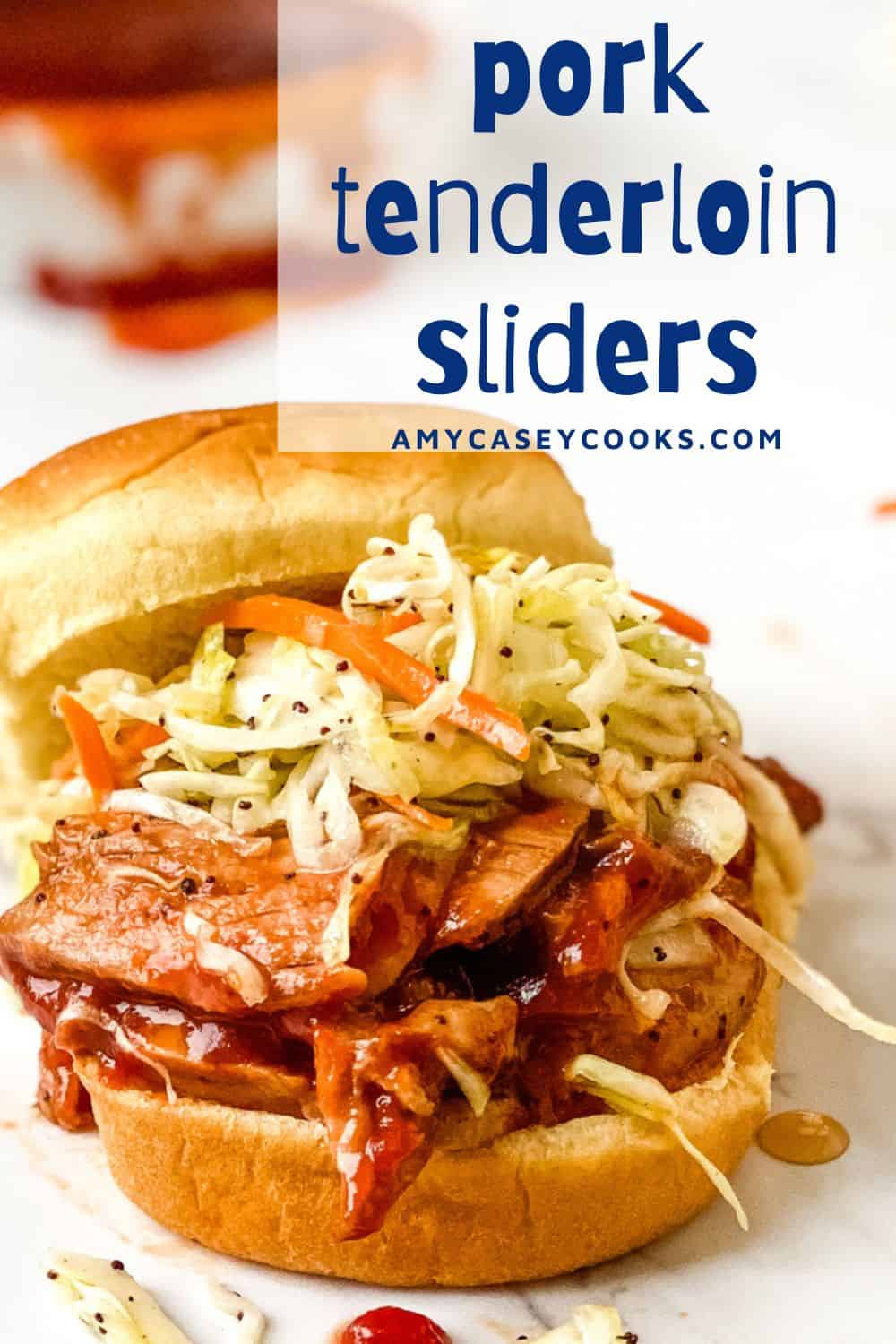 A pork tenderloin slider with cole slaw.