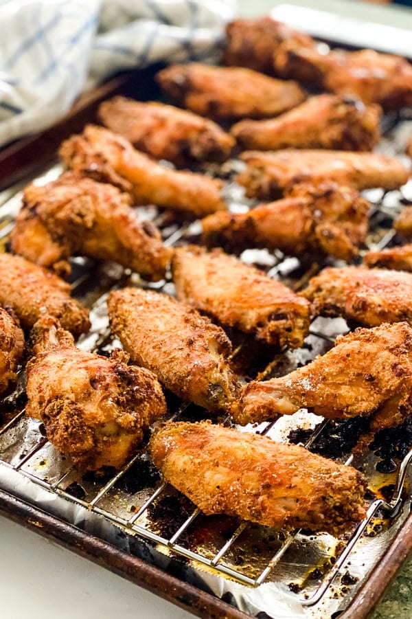 baking sheet with baked chicken wings