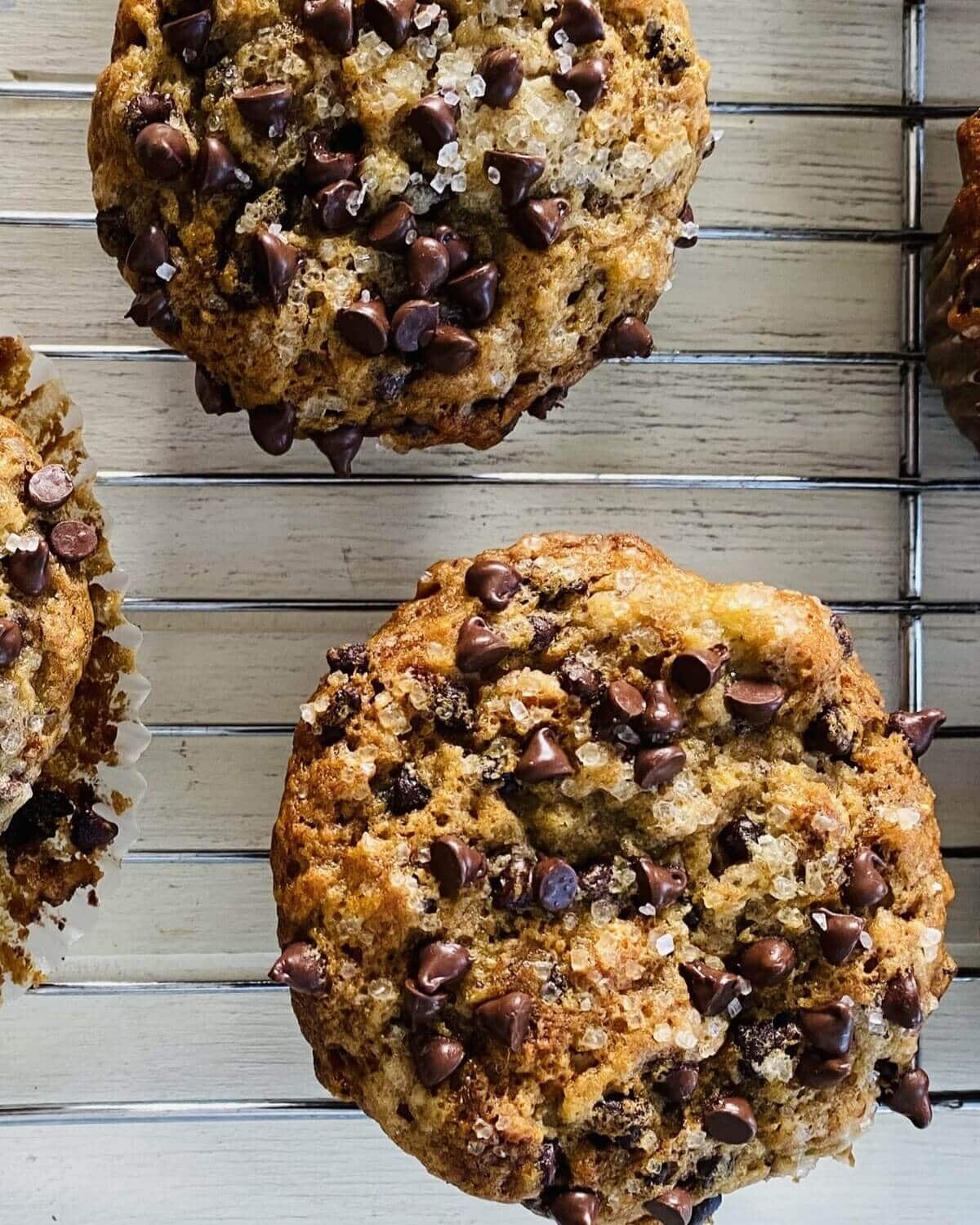 2 banana muffins on a cooling rack.