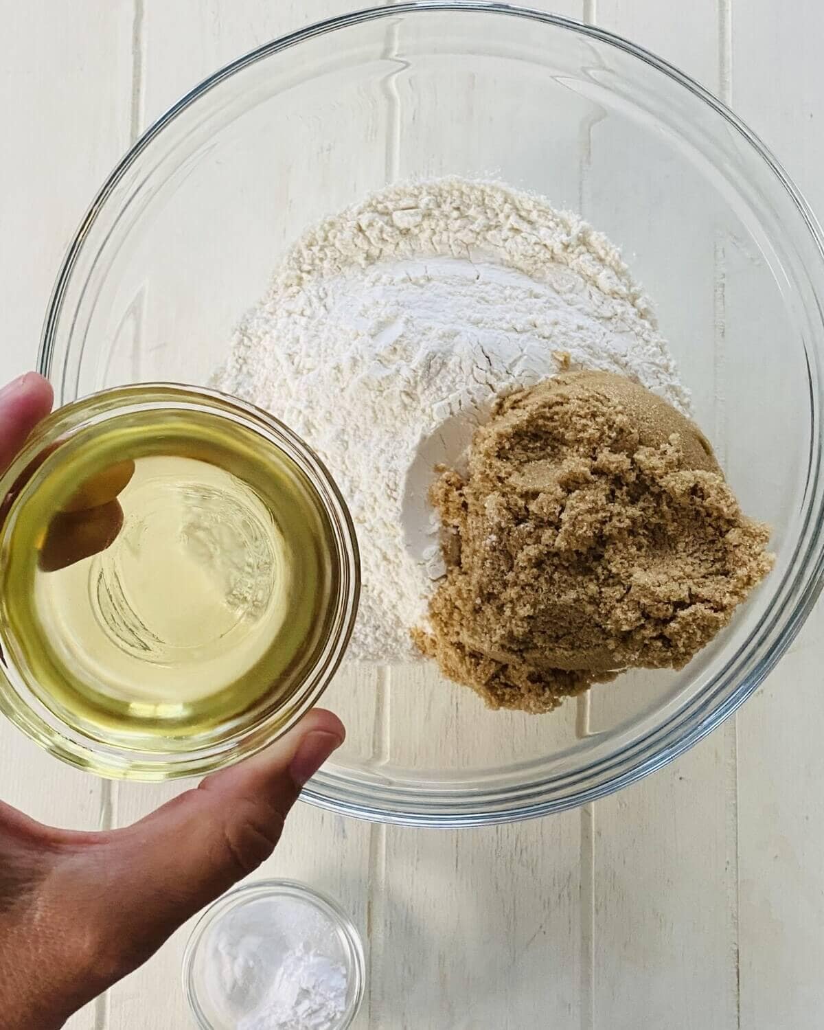 adding oil to flour and brown sugar.