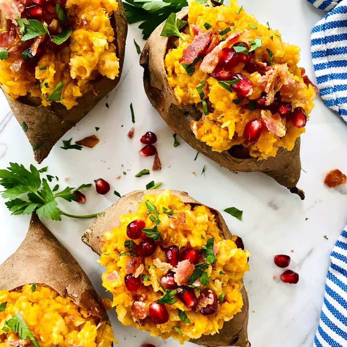 Fall side dish of apple bacon stuffed sweet potatoes.