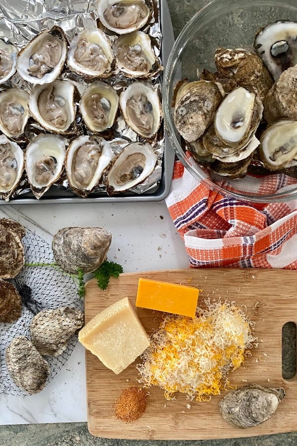 shucked oysters, shredded Parmesan and cheddar cheese