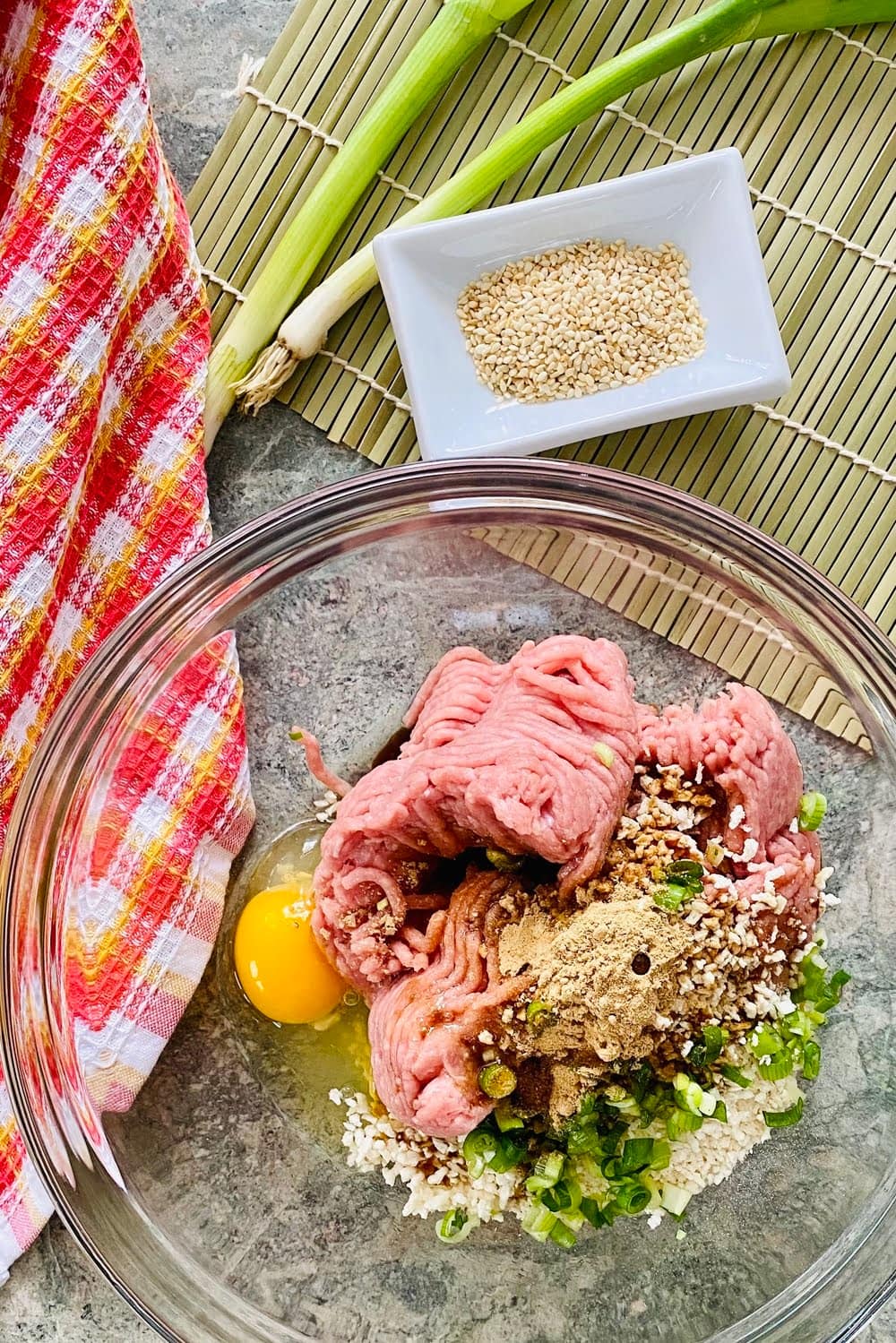ground turkey, egg, panko, scallion, ginger and garlic powder in a bowl.