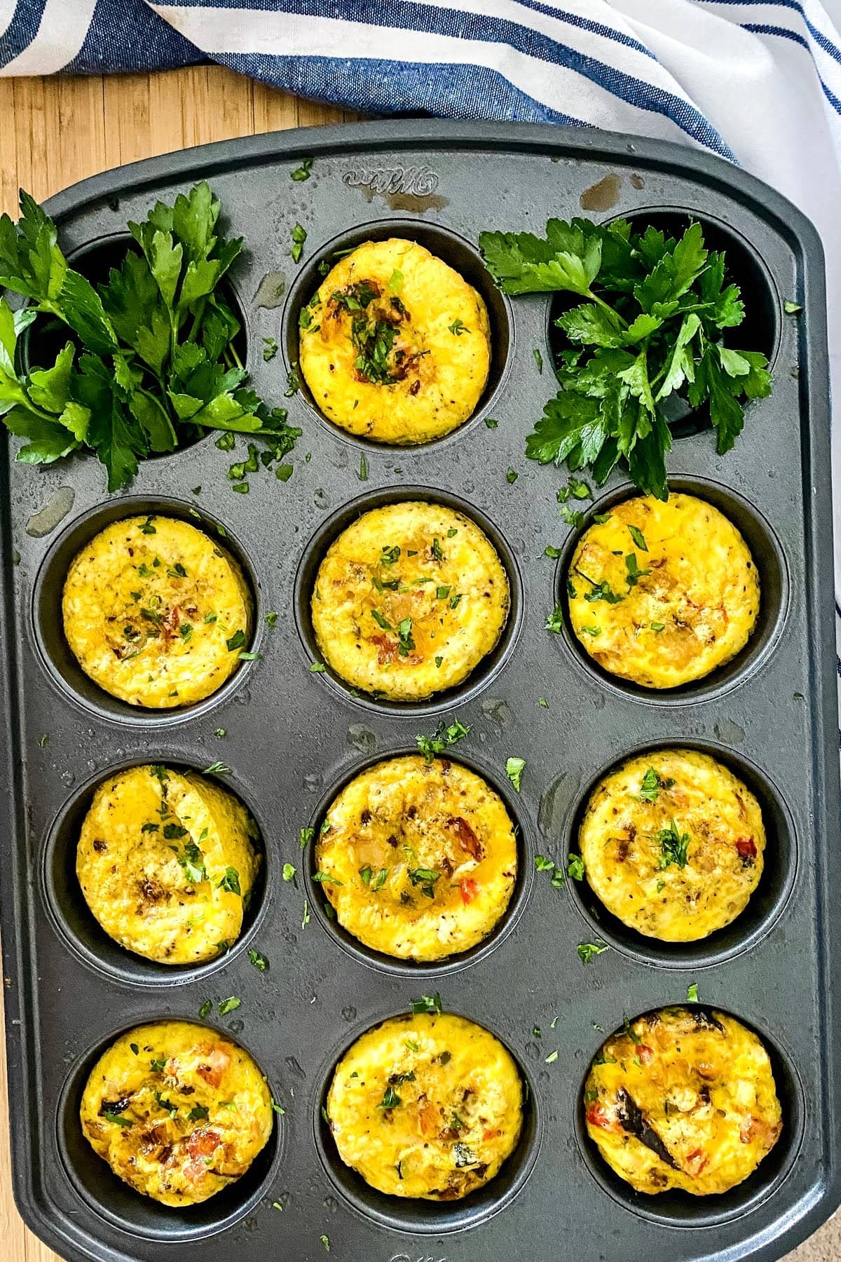 muffin tin with baked scrambled eggs