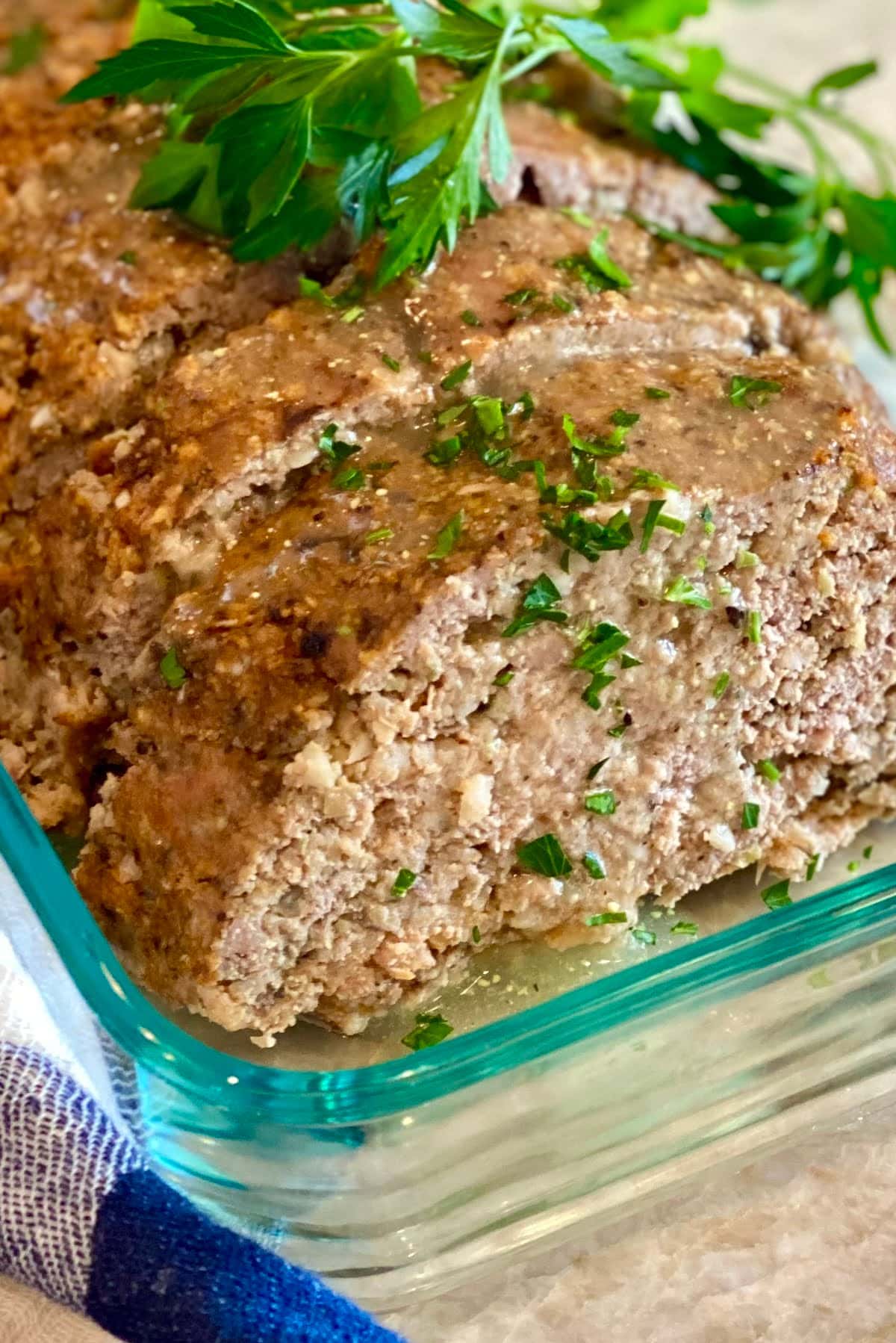 Sliced meatloaf with gravy.