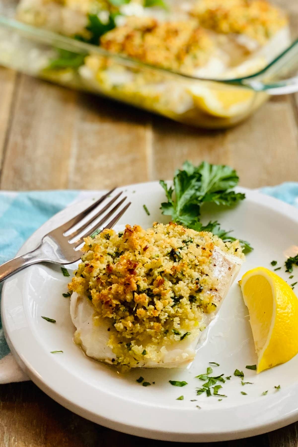 A piece of baked cod with crispy panko.