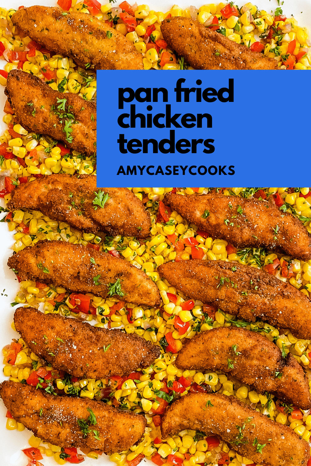 pan fried chicken tenders on a serving plate with fresh corn sauté