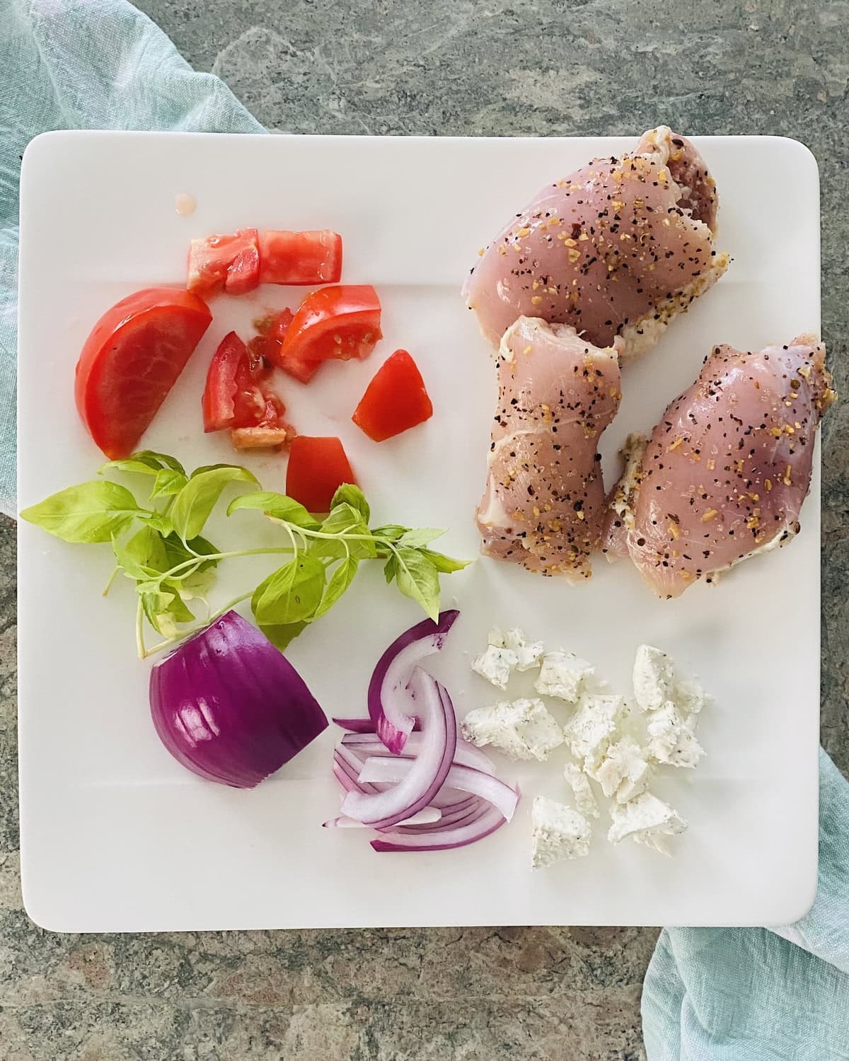 chicken thighs, chopped tomatoes, red onion goat cheese and fresh basil