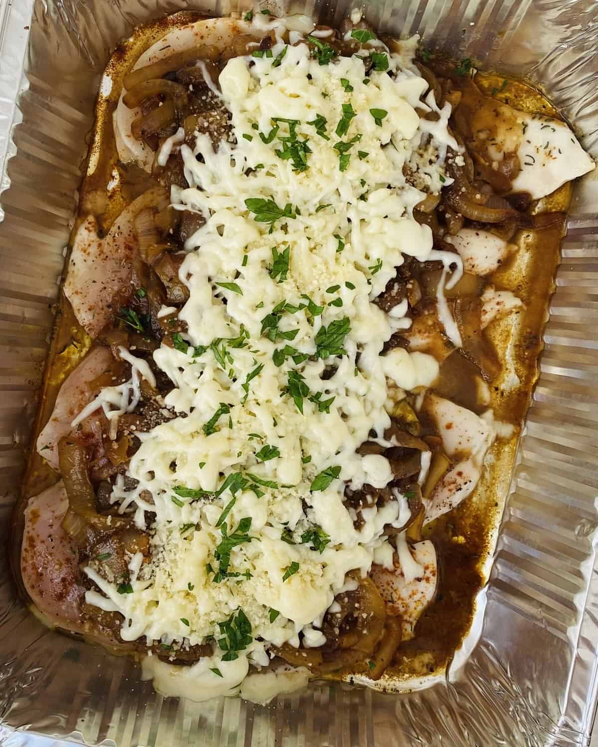 chicken topped with caramelized onions and mozzarella cheese