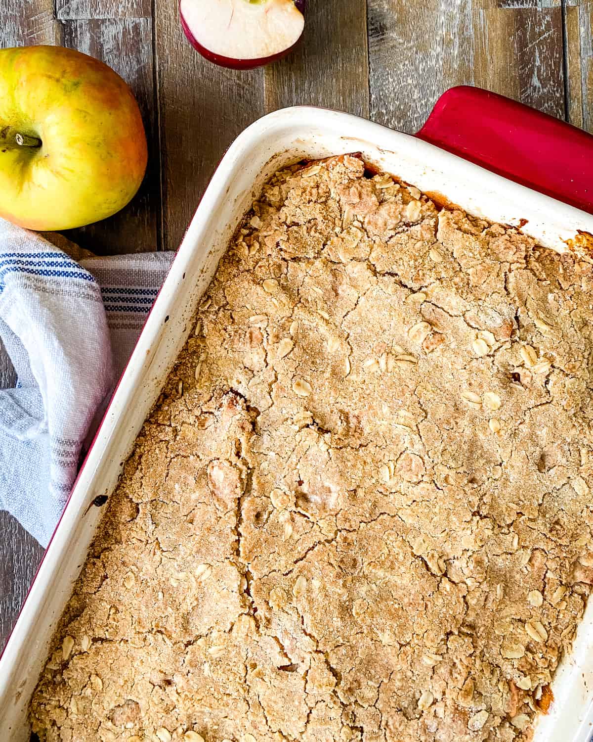 Baked apple crumb bars in a baking dish.