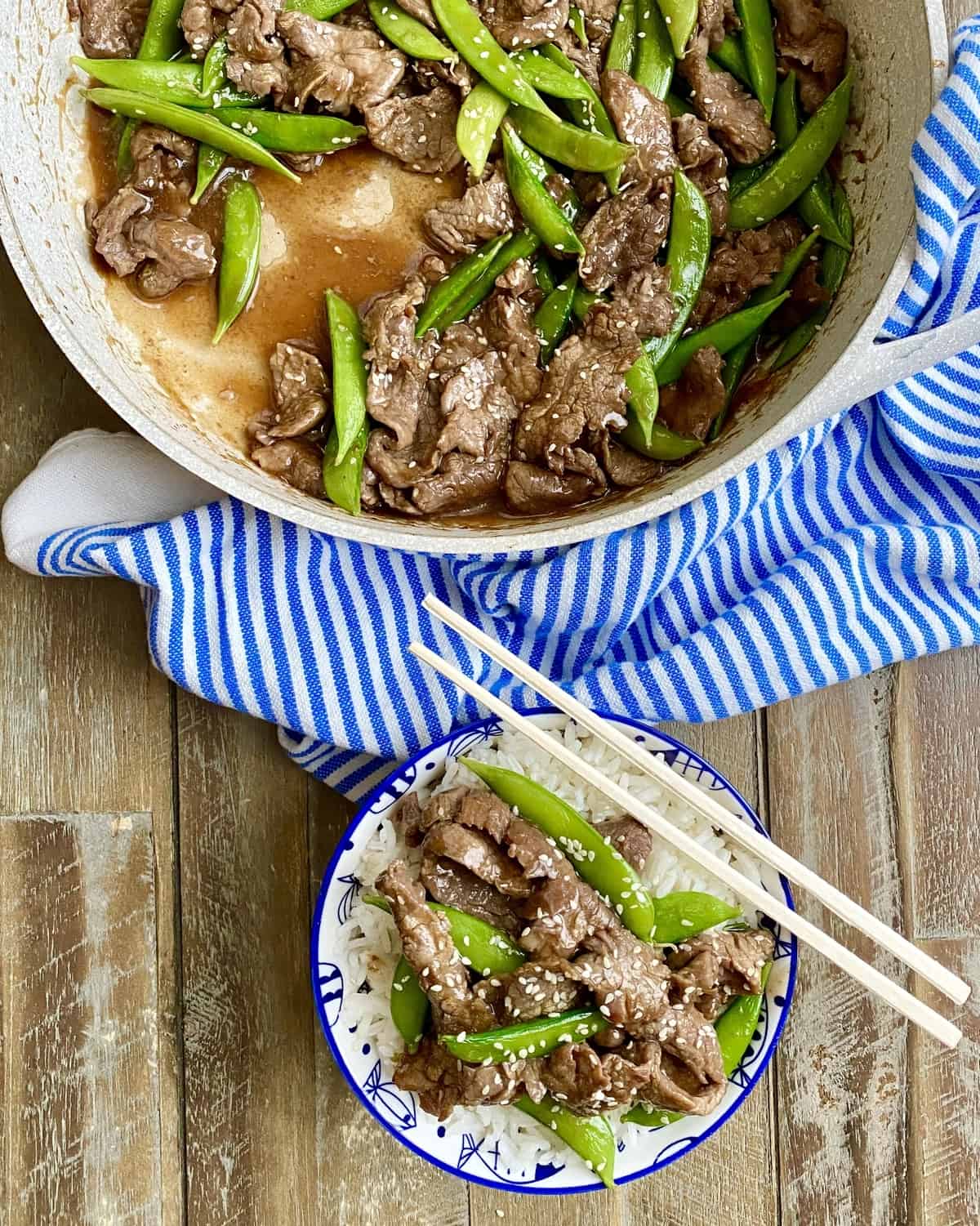 beef stir fry recipe in pan and a single serving