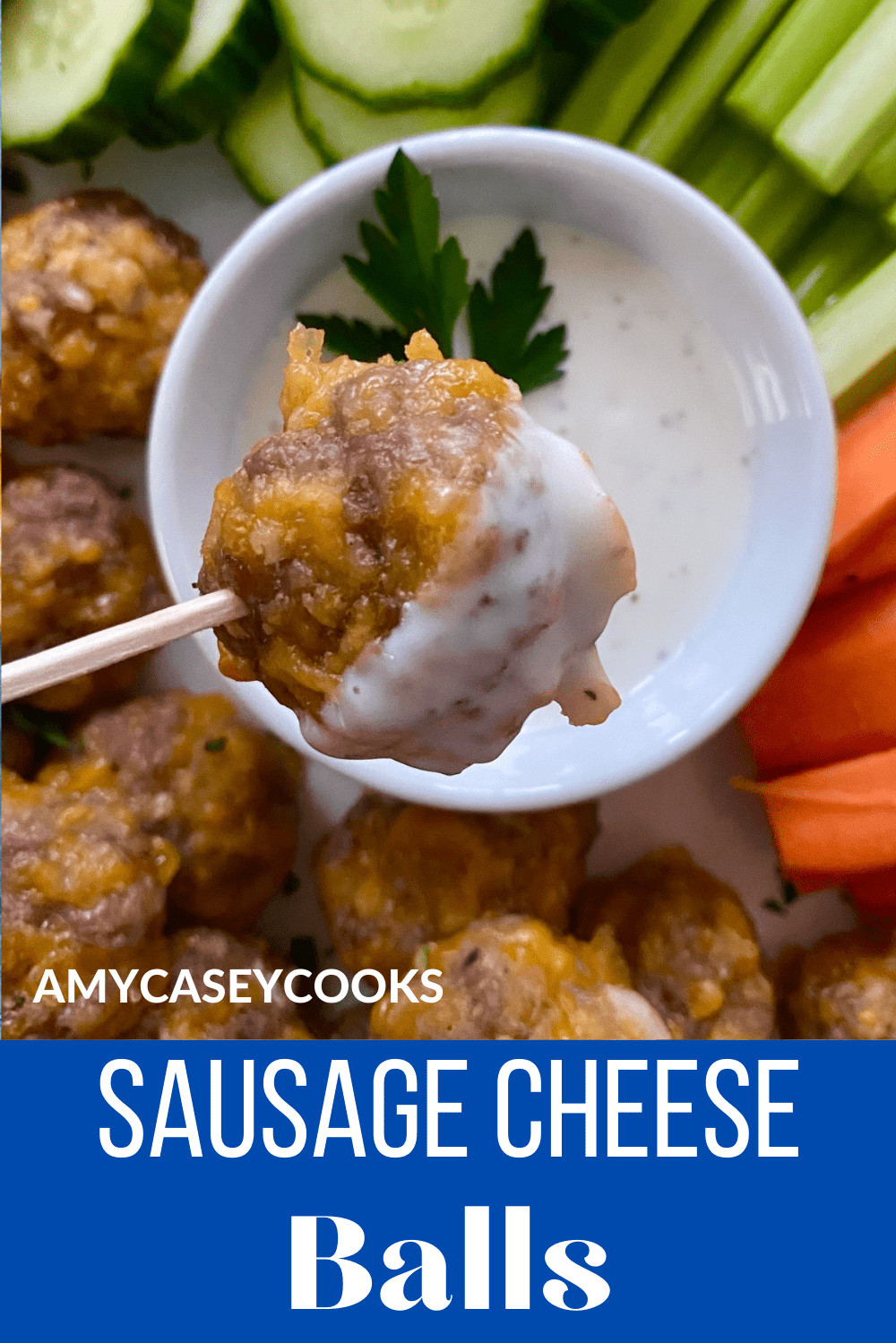 Sausage cheese ball on a toothpick and dipped in ranch dressing