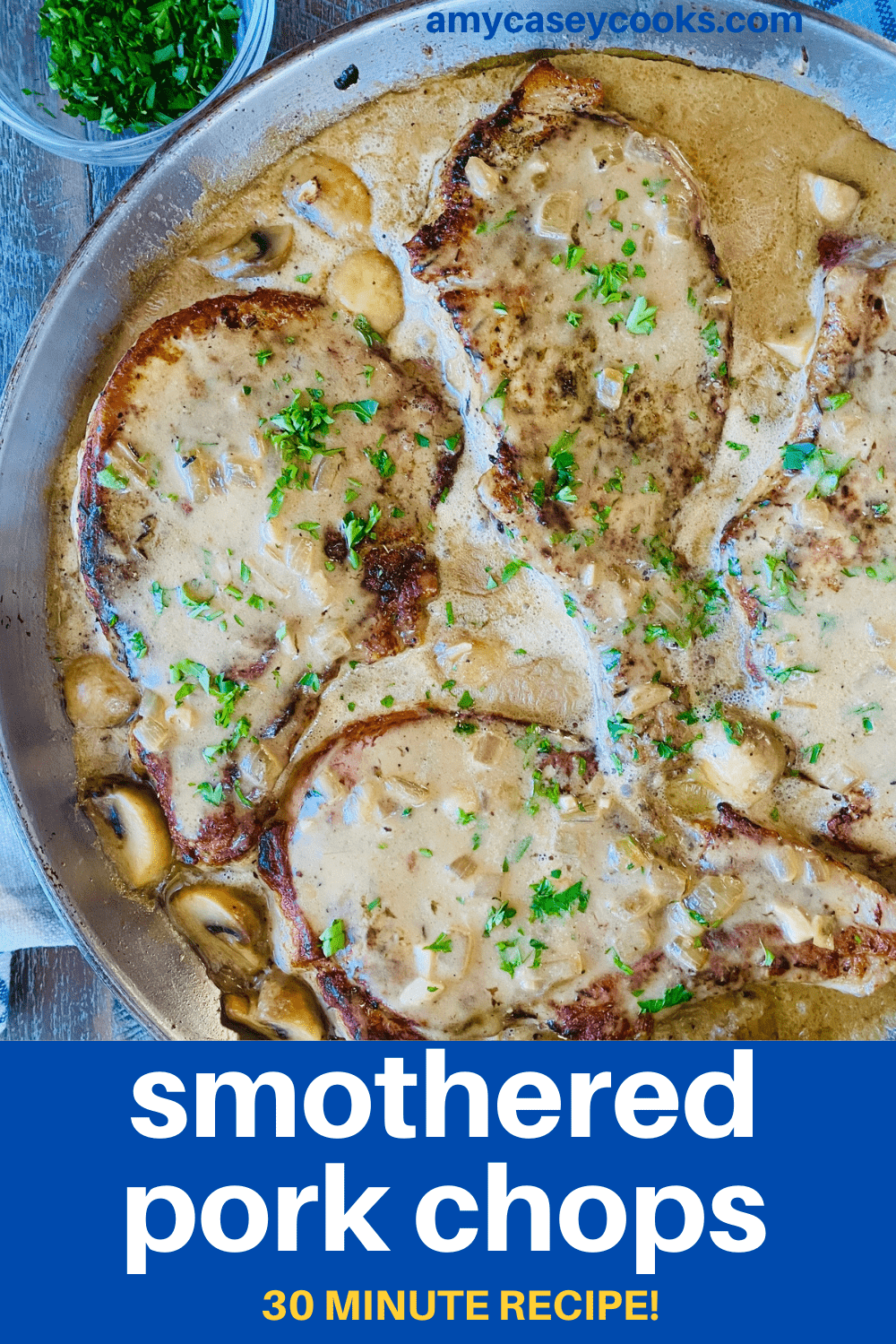 A pan of pork chops with a creamy gravy.