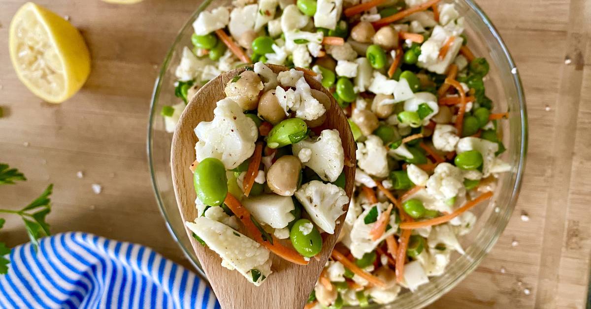 wooden spoon with cauliflower salad