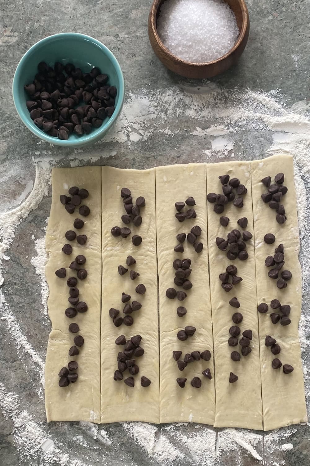 puff pastry with chocolate chips on a work surface