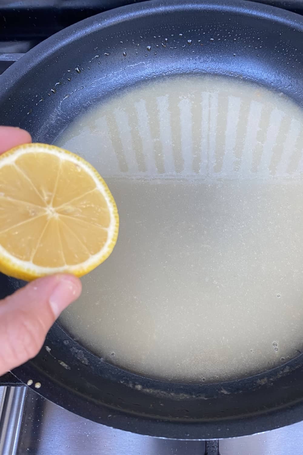 Adding lemon juice to sauce.