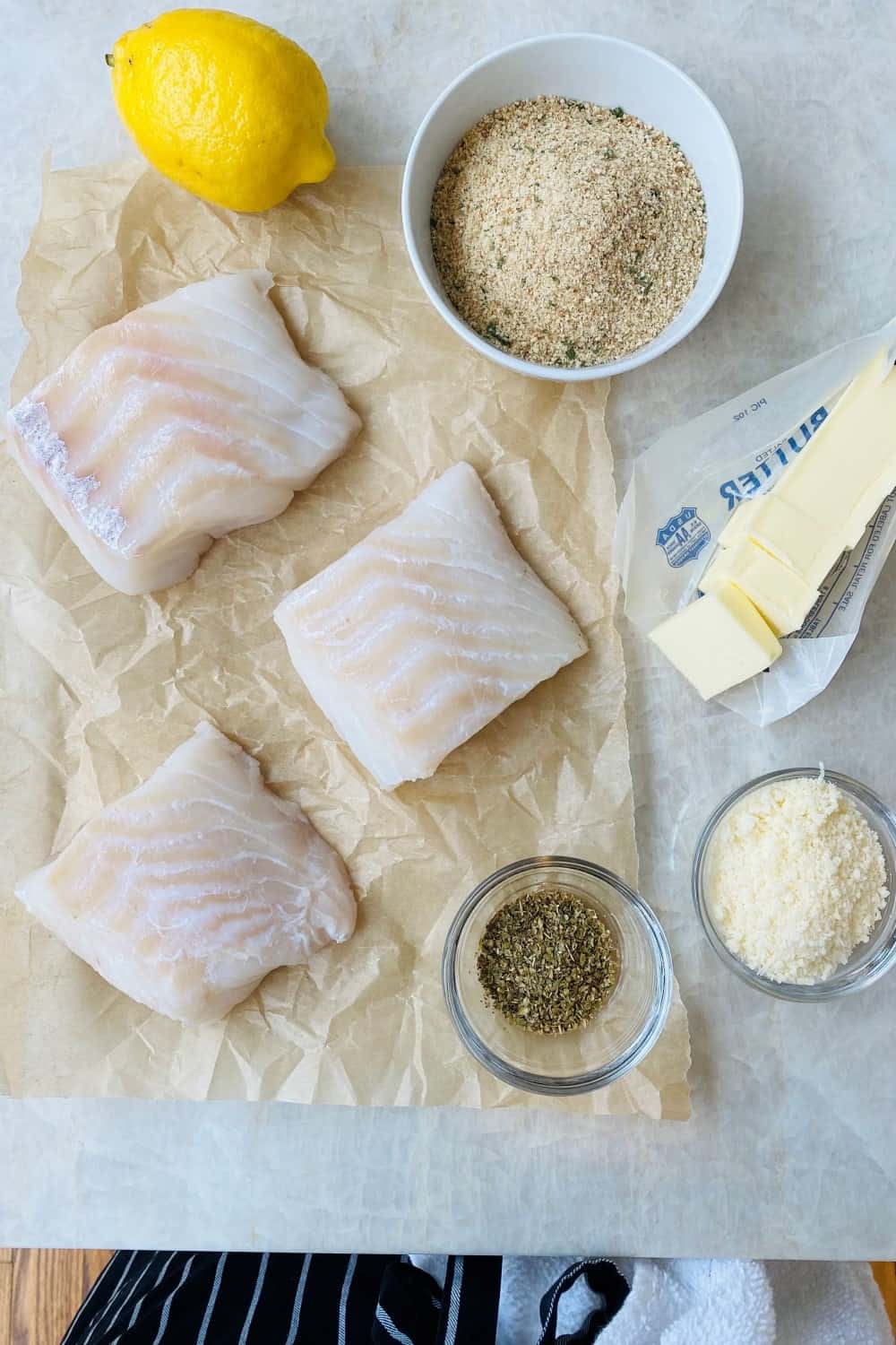 Cod, lemon, bread crumbs, Parmesan cheese, and butter.