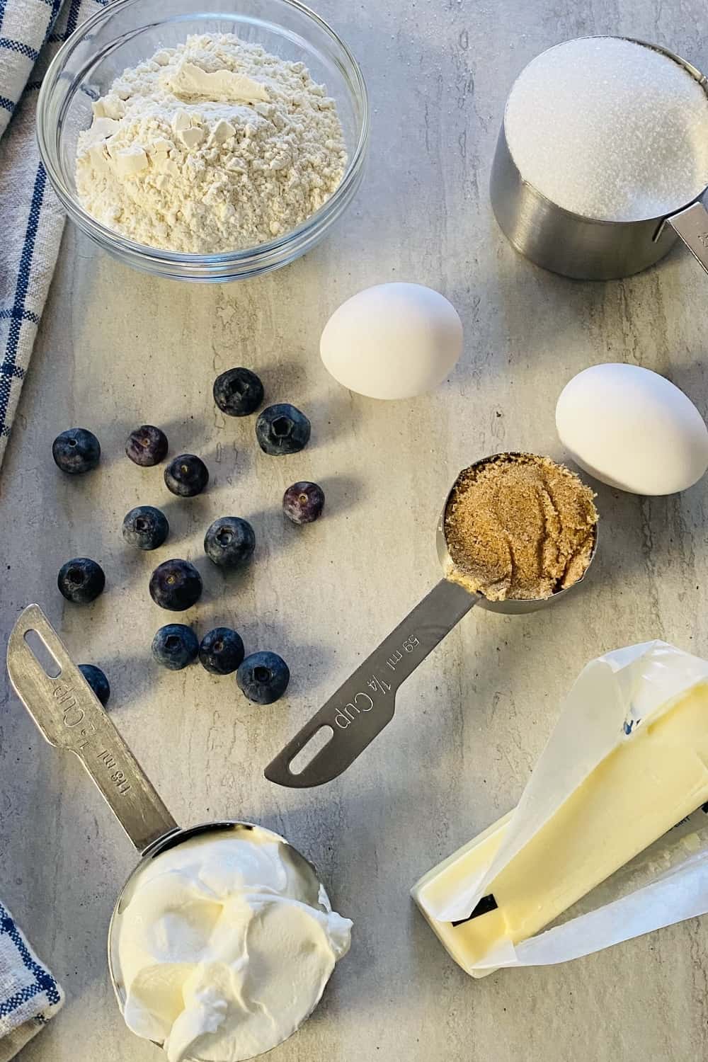Sour cream, flour, sugar, butter, eggs, and blueberries.