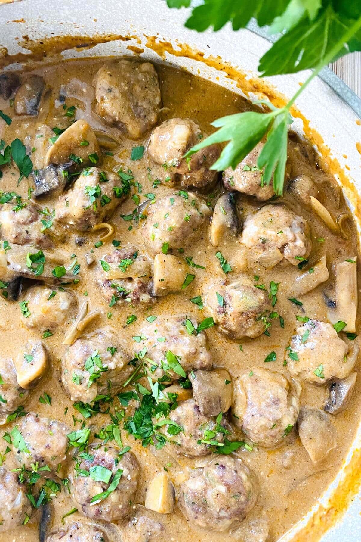 A large sauté pan with meatball stroganoff.