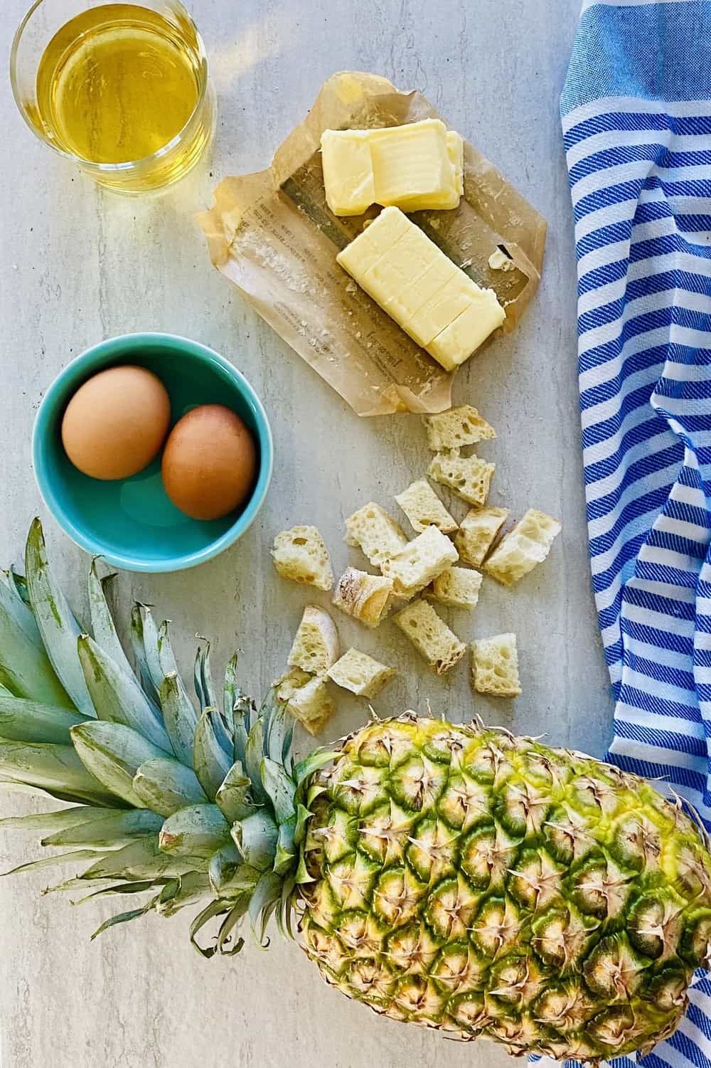 fresh pineapple, bread cubes, apple juice, eggs, butter.