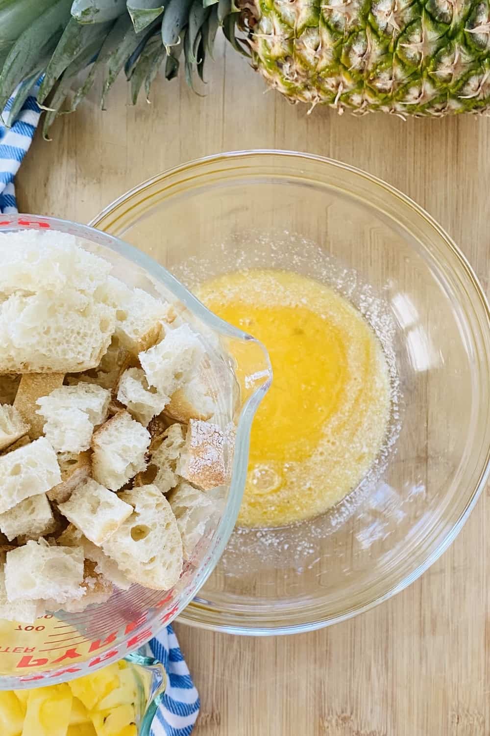 Bread cubes and a bowl of melted butter.