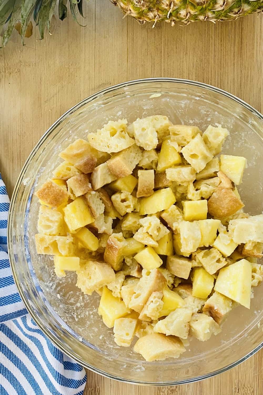 Pineapple bread pudding in a large glass bowl.