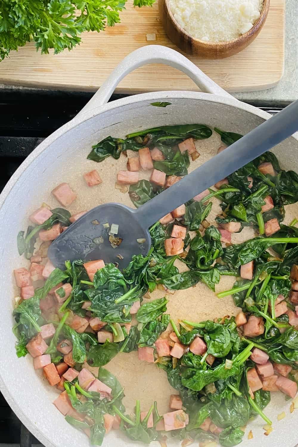 sauteing onion, ham and spinach